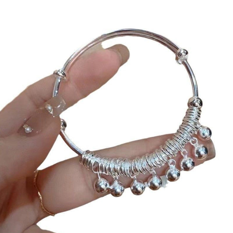 Justerbart silverarmband med klocka och berlock