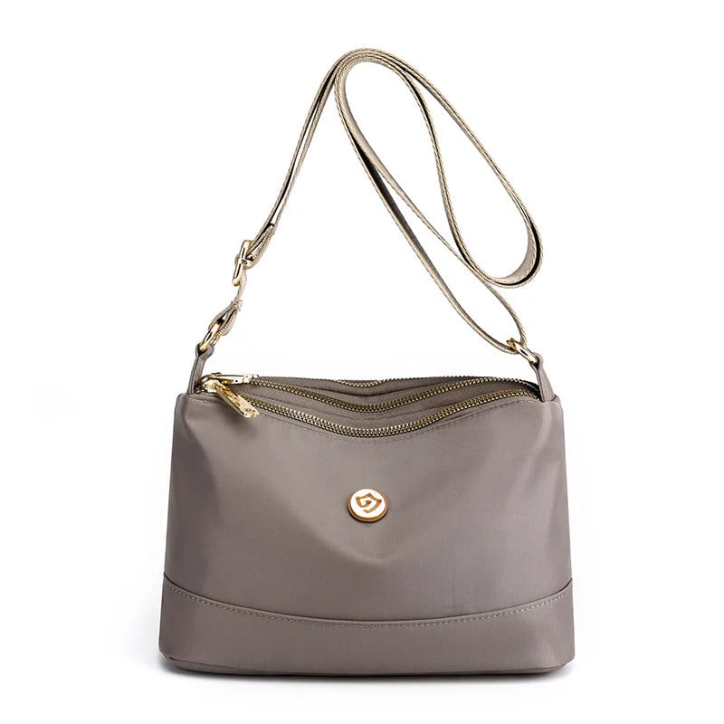 Minimalistisk axel- och crossbodyväska i nylon med stor kapacitet