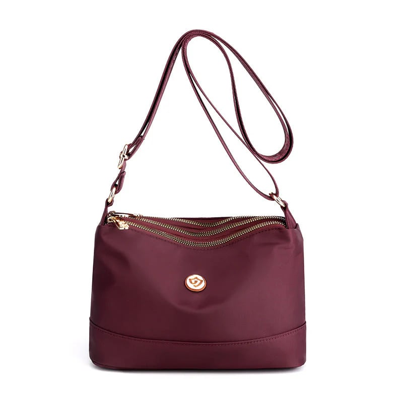Minimalistisk axel- och crossbodyväska i nylon med stor kapacitet