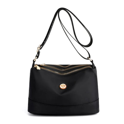 Minimalistisk axel- och crossbodyväska i nylon med stor kapacitet