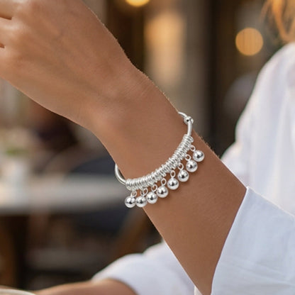 Justerbart silverarmband med klocka och berlock
