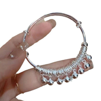 Justerbart silverarmband med klocka och berlock